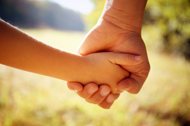 parent and child holding hands