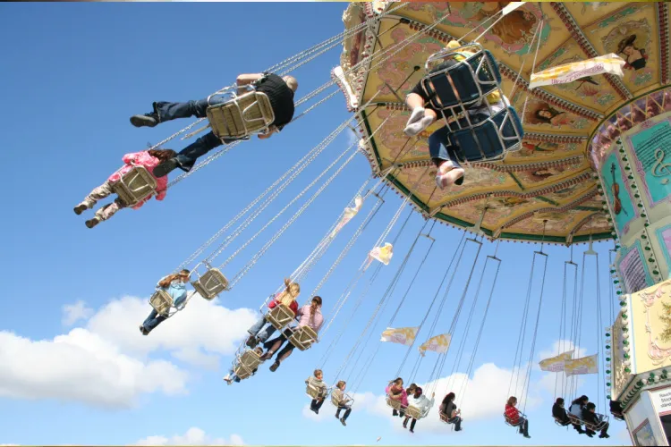 children on the swing ride that spins