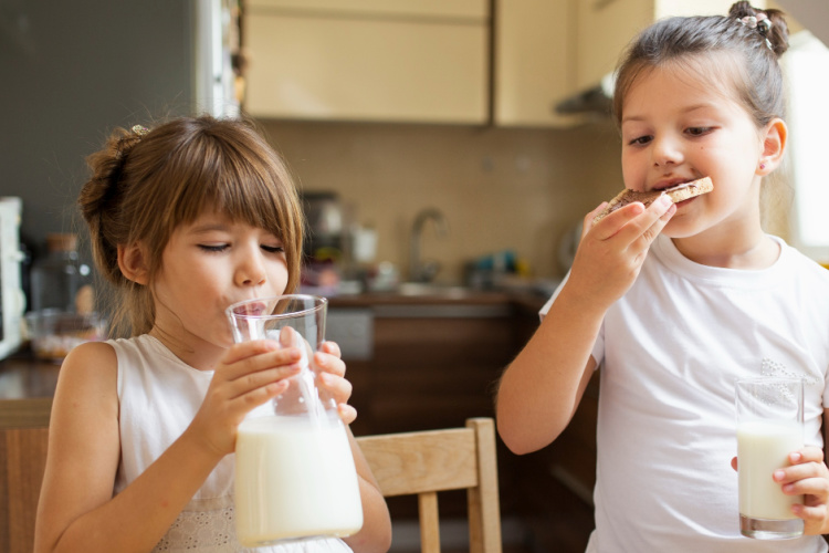 two little girls having breakfast